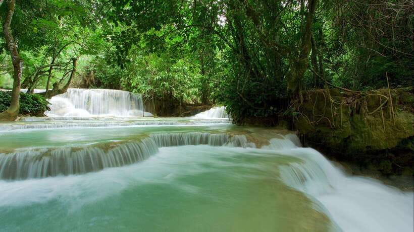 Luang Prabang: Kuang Si Bike Ride & Long-Tail Boat Cruise - Arriving at Kuang Si Waterfall