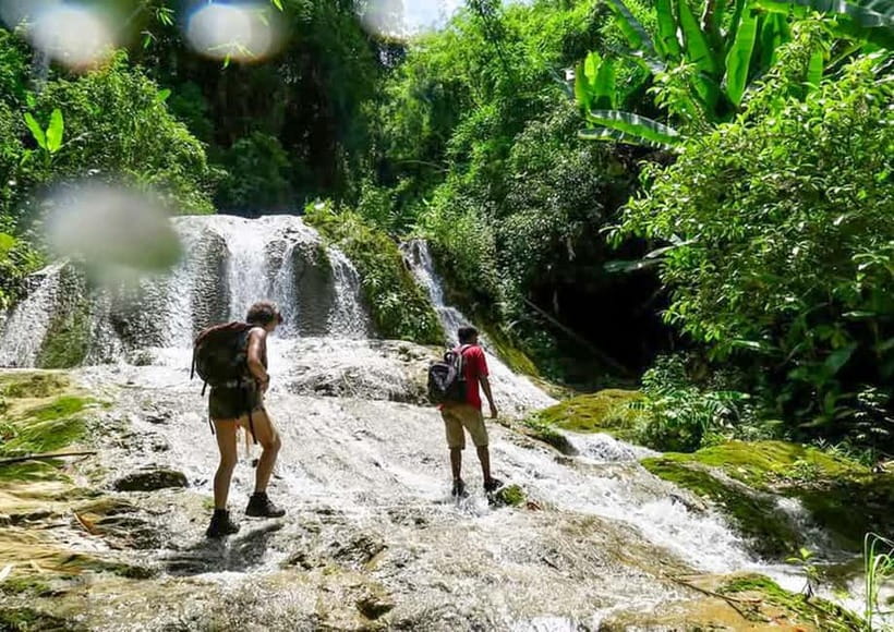 Nong Khiaw: 100 Waterfalls, Nam Ou & Khmu Village Day Tour - A small village stop with one important caveat