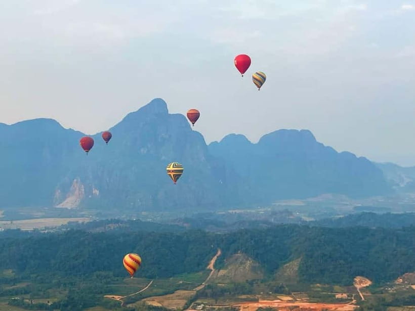 Vang Vieng: Hot Air Balloon Ride with City Hotel Pickup - Seeing Vang Vieng from a balloon basket