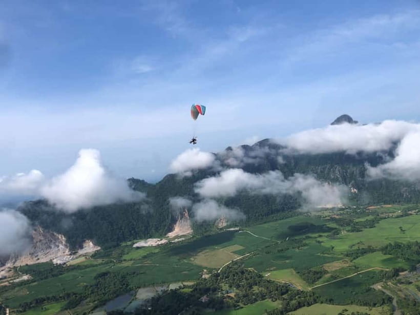 Vang Vieng: Paragliding Experience with Hotel Pickup - Taking off above Vang Vieng’s limestone country