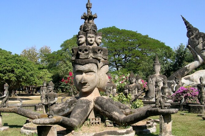 Vientiane City Day Tour and Buddha Park Visit with Lunch | Laos - Buddha Park’s giant figures beside the Mekong